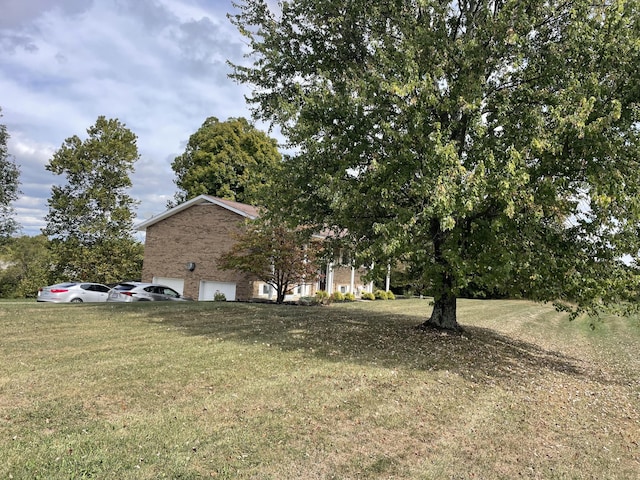 view of yard featuring a garage