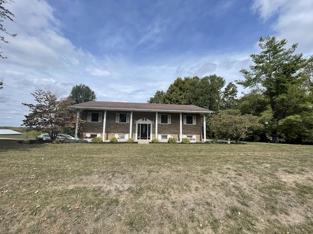 split foyer home with a front lawn