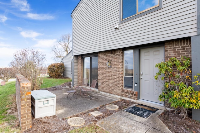 property entrance with a patio