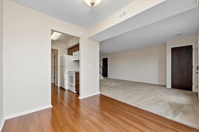 empty room with light hardwood / wood-style floors