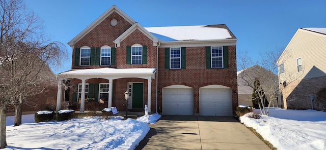 view of front of home with a garage and covered porch