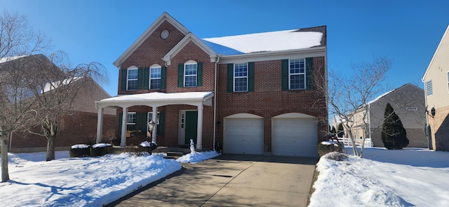 view of front of home with a garage and covered porch