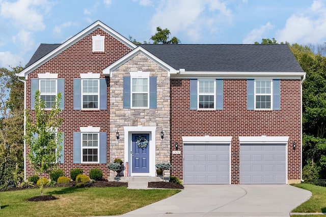 view of front of house featuring a front lawn and a garage