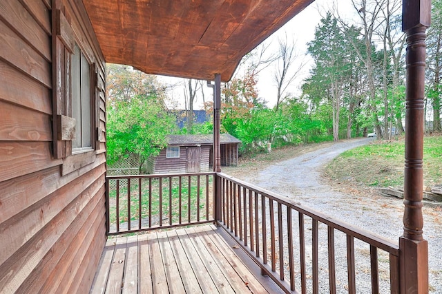 wooden terrace with a storage unit