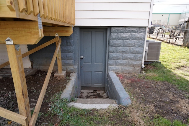 doorway to property featuring central AC unit