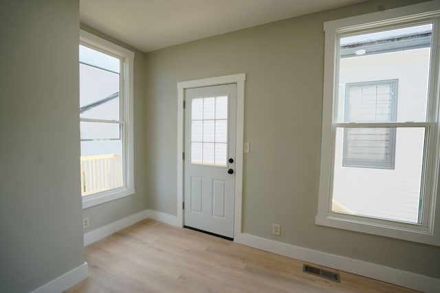 entryway with light hardwood / wood-style floors