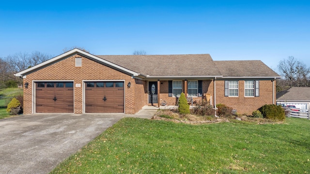 ranch-style house with a front yard and a garage