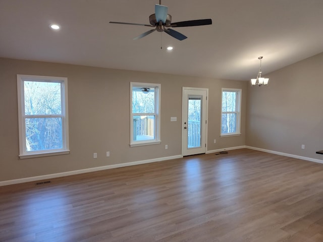 spare room with light wood-style floors, recessed lighting, visible vents, and baseboards