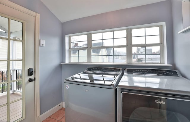 washroom featuring independent washer and dryer and light tile patterned flooring