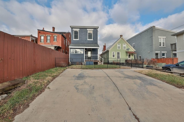 back of property featuring a porch