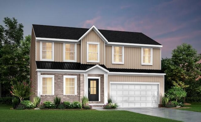 view of front facade with a garage and a lawn