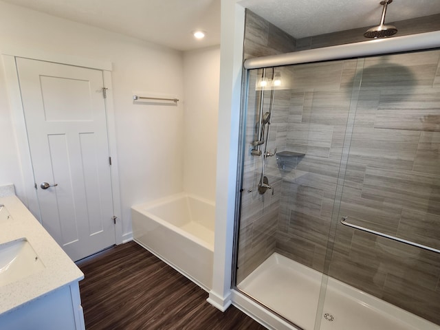 6566 Cannondale Dr, Burlington, KY 41005 - full bathroom with a shower stall, wood finished floors, double vanity, and a bathtub