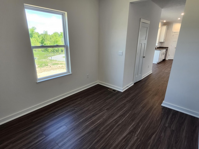 6566 Cannondale Dr, Burlington, KY 41005 - empty room with baseboards, dark wood-style floors, a sink, and recessed lighting