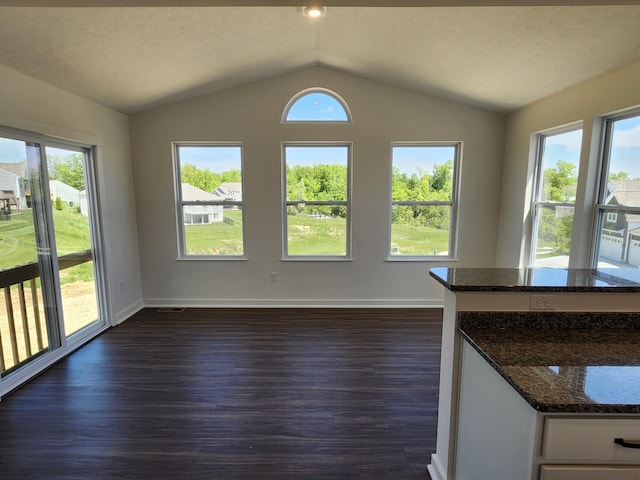 6566 Cannondale Dr, Burlington, KY 41005 - unfurnished dining area featuring dark wood finished floors, lofted ceiling, and baseboards