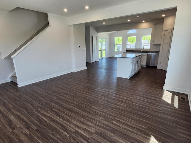 6566 Cannondale Dr, Burlington, KY 41005 - unfurnished living room featuring stairway, dark wood-type flooring, recessed lighting, baseboards, and a sink