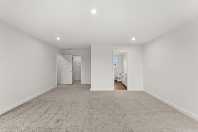6566 Cannondale Dr, Burlington, KY 41005 - unfurnished bedroom featuring carpet floors, recessed lighting, baseboards, a spacious closet, and connected bathroom