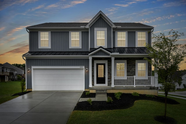 6566 Cannondale Dr, Burlington, KY 41005 - view of front facade with board and batten siding, a porch, driveway, an attached garage, and a standing seam roof