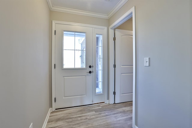 doorway to outside with ornamental molding and light hardwood / wood-style floors