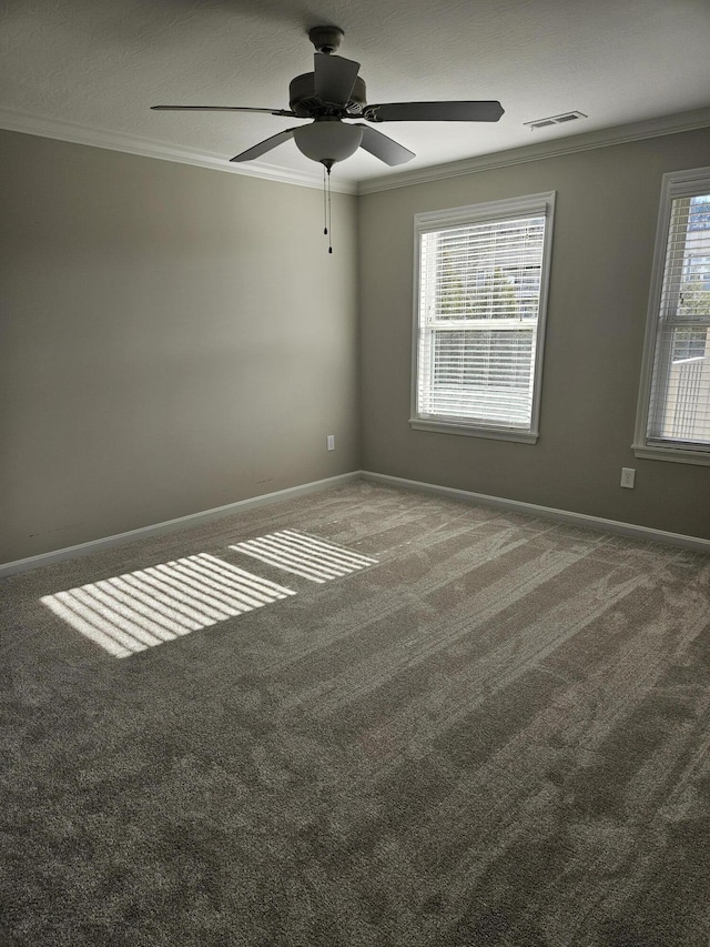 unfurnished room featuring ornamental molding, carpet flooring, and ceiling fan