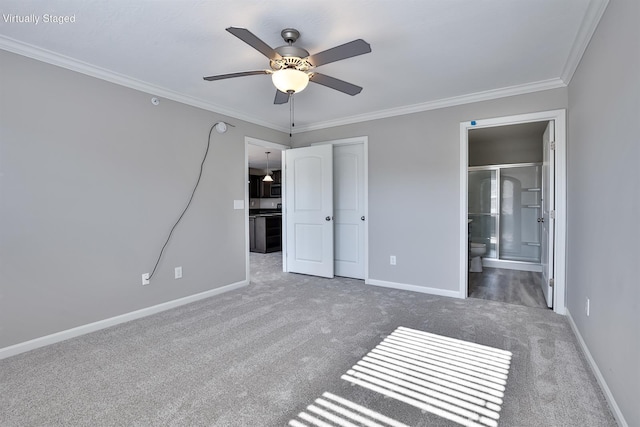 unfurnished bedroom with crown molding, ceiling fan, dark carpet, and ensuite bath