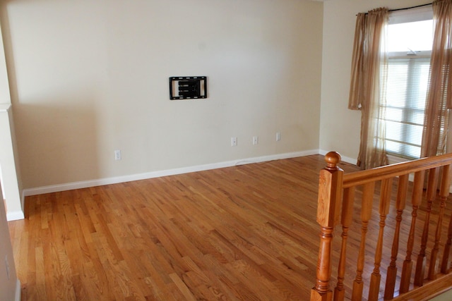 unfurnished room with light hardwood / wood-style flooring