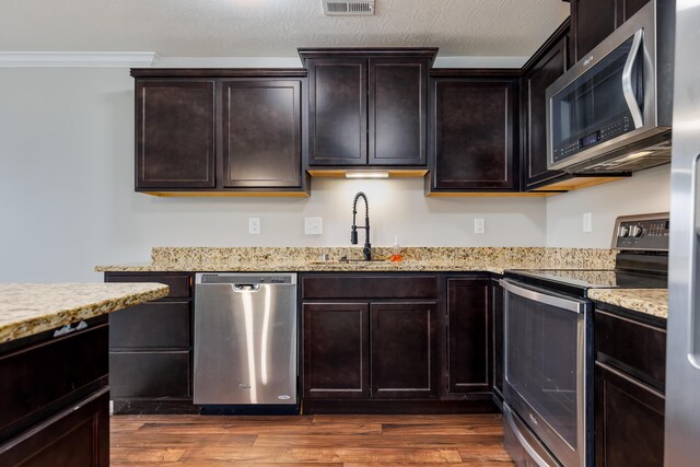 4212 Country Mill Rdg, Burlington, KY 41005 - kitchen featuring appliances with stainless steel finishes, dark brown cabinetry, dark hardwood / wood-style floors, and sink