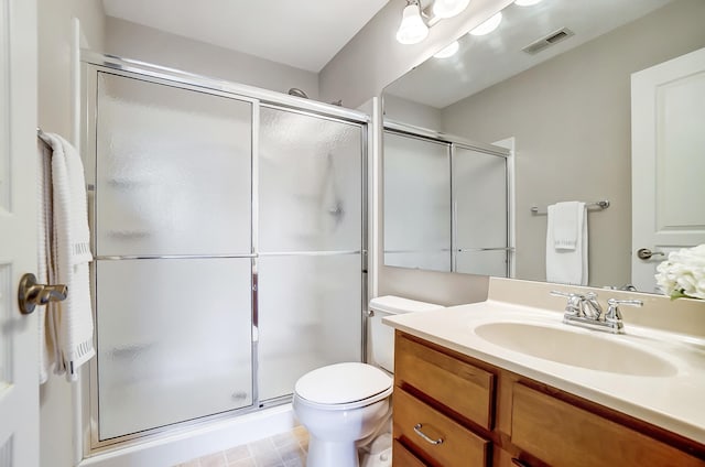 bathroom featuring vanity, toilet, and walk in shower