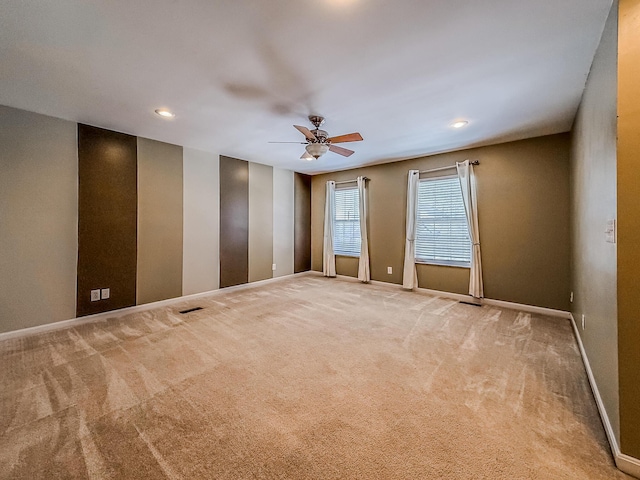 carpeted empty room with ceiling fan