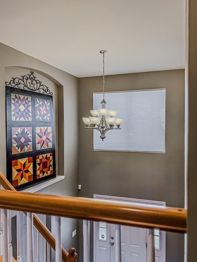 interior details featuring a chandelier