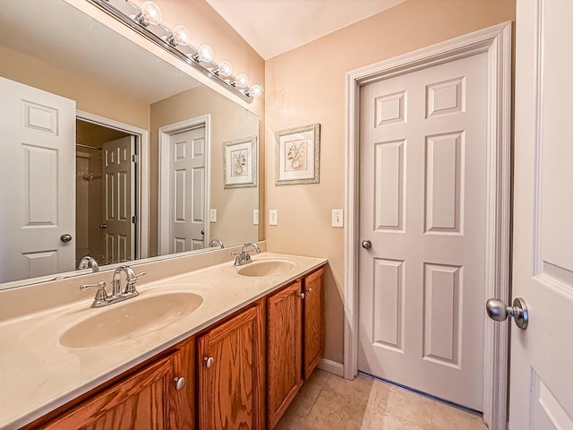 bathroom with tile patterned floors and vanity