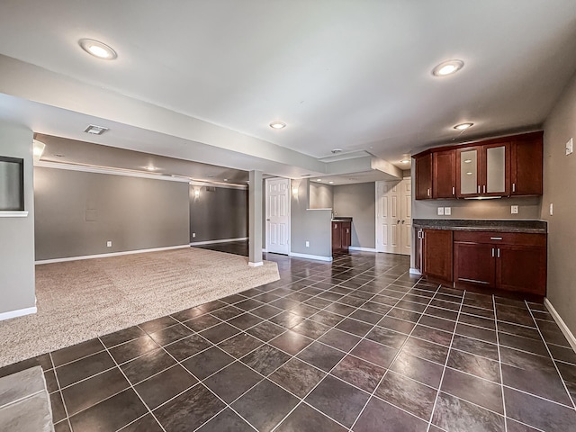 kitchen featuring dark carpet