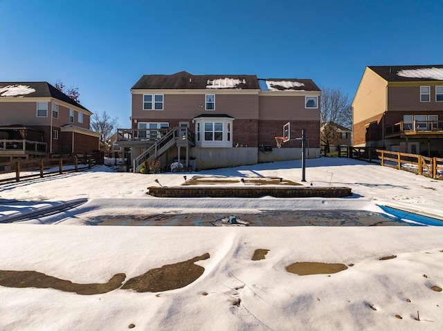 view of snow covered house