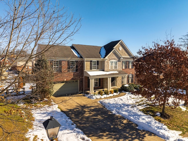 view of front of property with covered porch and a garage