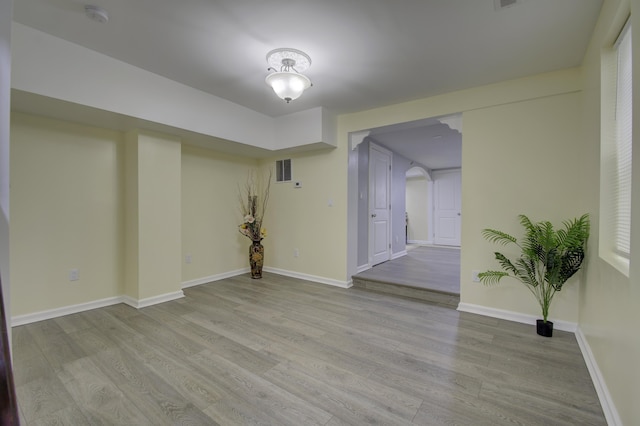 spare room with light hardwood / wood-style floors