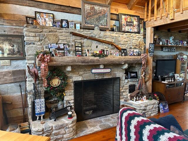 living area featuring a fireplace and wood finished floors