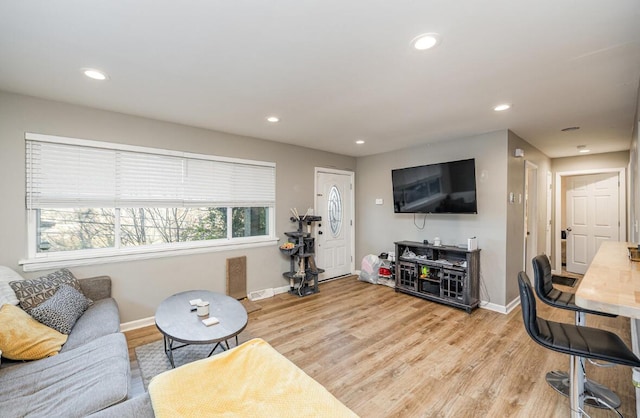 living room with light hardwood / wood-style floors