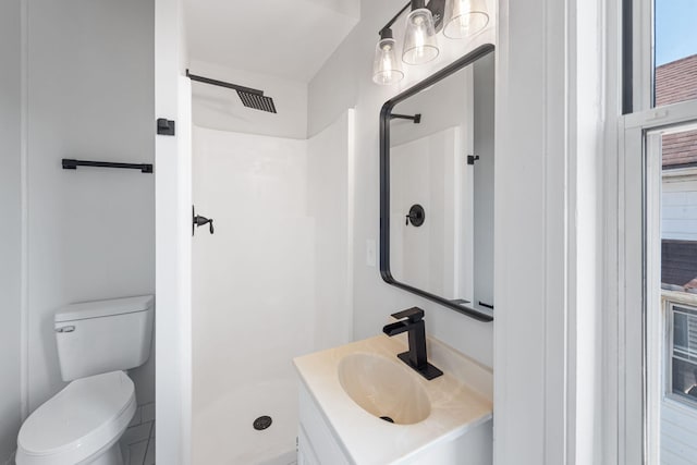 bathroom with a shower, sink, and toilet