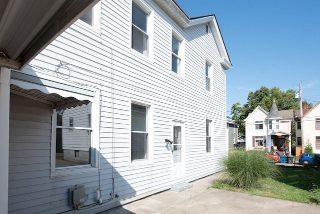 view of side of home featuring a patio area