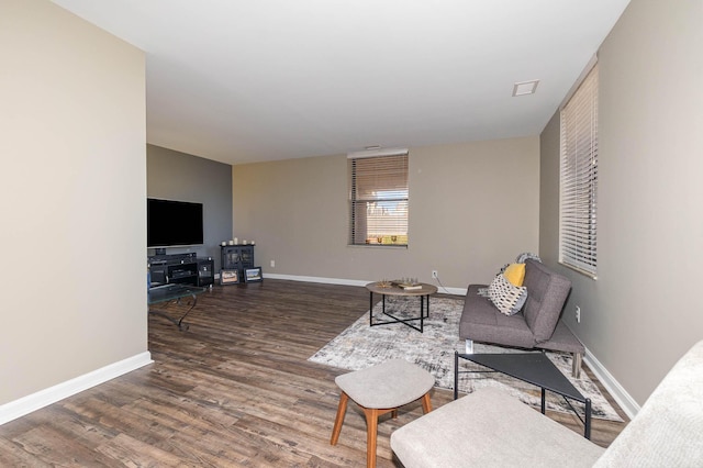 living room featuring dark hardwood / wood-style floors