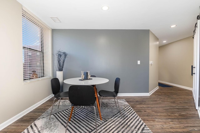 dining area with dark wood-type flooring