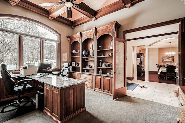 carpeted home office featuring coffered ceiling, ceiling fan with notable chandelier, beam ceiling, and decorative columns