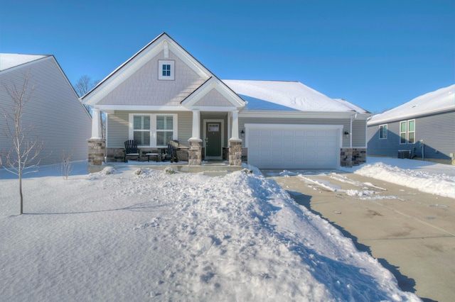 craftsman house with covered porch and a garage