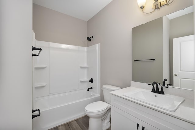 full bathroom featuring wood-type flooring, vanity, toilet, and shower / washtub combination