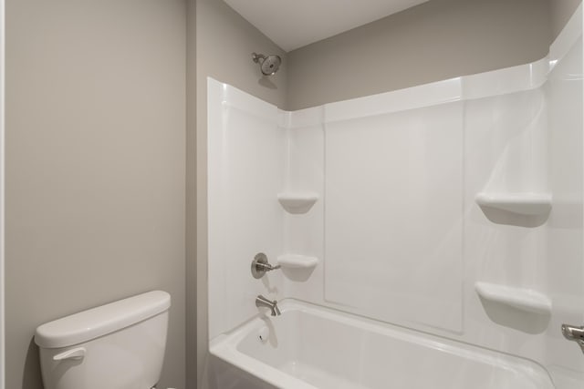 bathroom with shower / bath combination and toilet