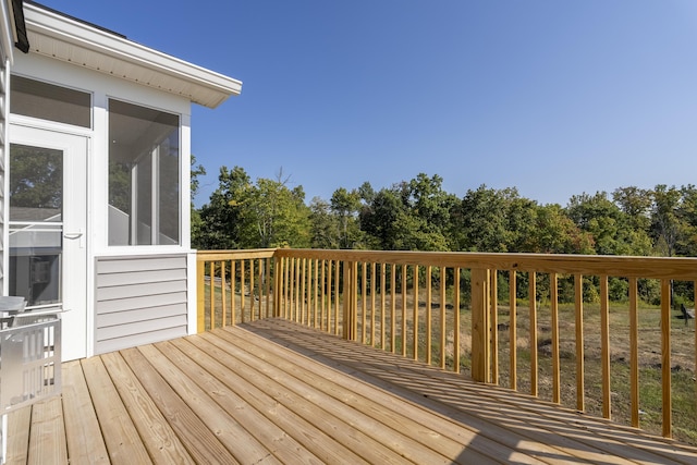 deck with a sunroom