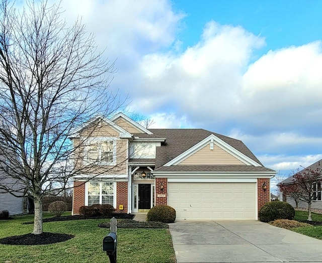 view of front of home with a front lawn and a garage