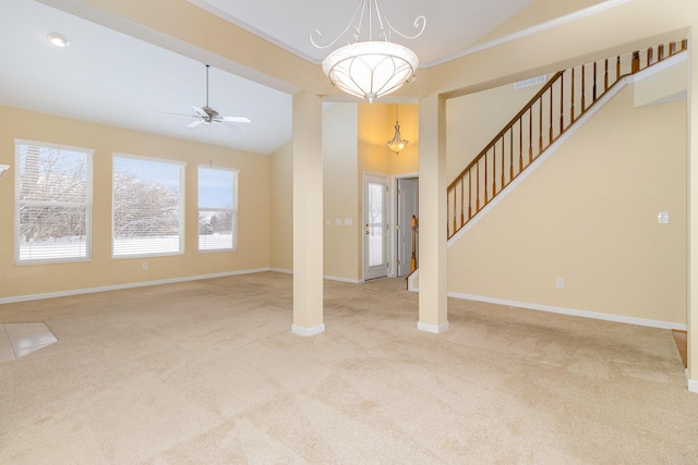 unfurnished living room with light colored carpet, ceiling fan, and lofted ceiling