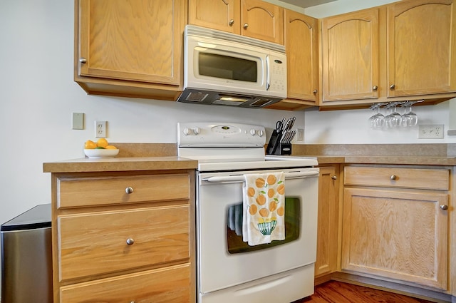 kitchen with white appliances, dark wood-type flooring, and light brown cabinetry