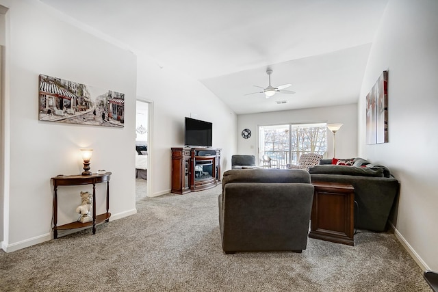 living room featuring light carpet, vaulted ceiling, and ceiling fan