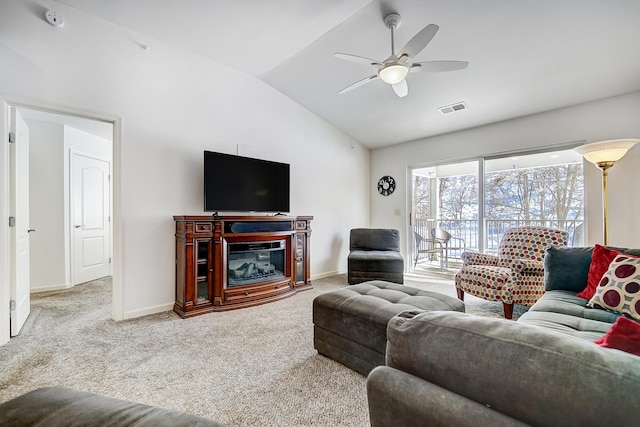 living room with carpet, ceiling fan, and lofted ceiling